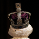 An image of the late Queen Elizabeth II wearing her crown is shown.